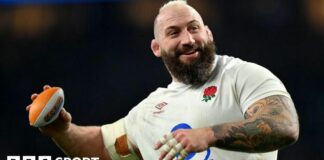 Joe Marler throwing a mini rugby ball.