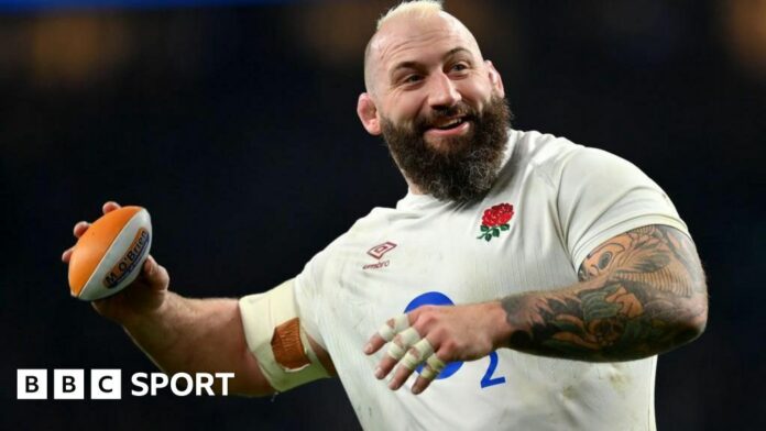 Joe Marler throwing a mini rugby ball.