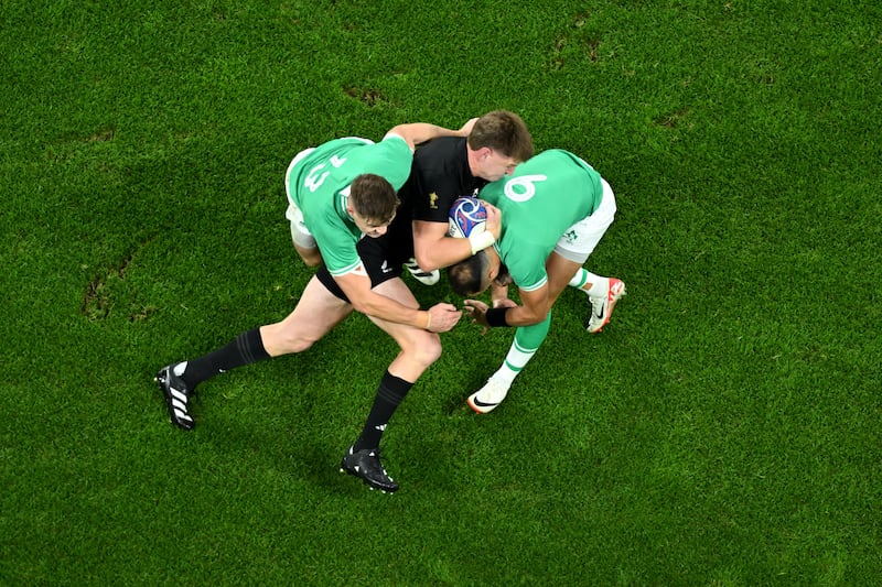 Jordie Barrett of New Zealand is tackled by Garry Ringrose and Jamison Gibson-Park of Ireland. Photograph: Mike Hewitt/Getty