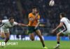 Joseph-Aukuso Suaalii passes the ball over George Furbank