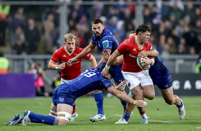 Munster’s Calvin Nash tackled by Leinster's Ryan Baird and James Lowe. Photograph: Dan Sheridan/Inpho