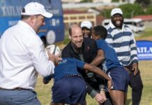 Prince William plays rugby on S.Africa climate prize