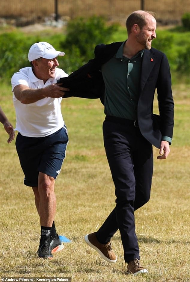 The Prince of Wales plays rugby with Joel Stransky today during the session in Cape Town