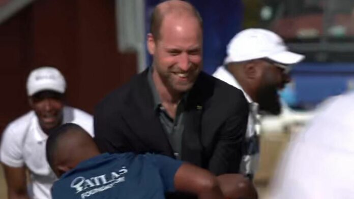 Prince William tackled by students in rugby team game during Cape Town visit