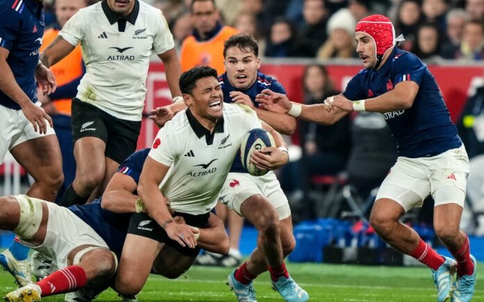 New Zealand's Caleb Clarke is tackled against France, 2024