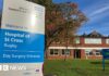 The front of the Hospital of St Cross with a blue and silver NHS sign and brick buildings in the background.