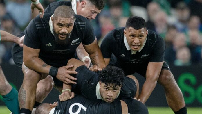 Patrick Tuipulotu #19 of New Zealand is protected by teammates in the build up to the France vs New Zealand Autumn Internationals match.