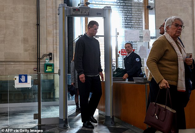 New Zealander Dylan Hayes, who is charged with failing to prevent a crime, goes through security as he arrives for his trial at the Bordeaux courthouse, in Bordeaux south-western France, on December 2, 2024