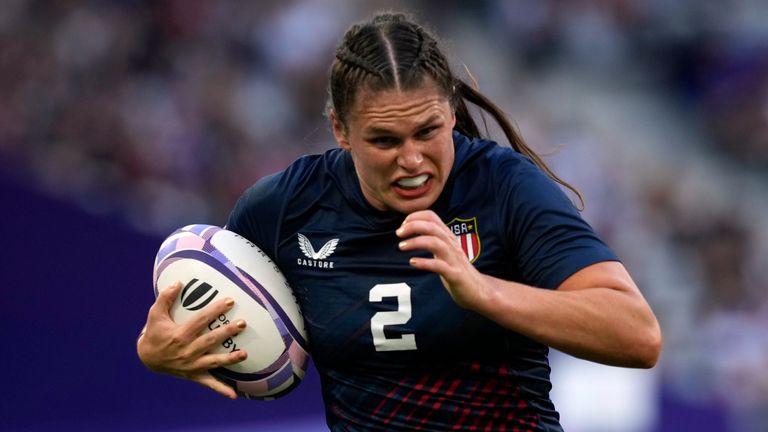 United States forward Ilona Maher carries the ball during the women's Rugby Sevens match between the United States and Brazil at the 2024 Olympics (AP Photo/Tsvangirayi Mukwazhi)