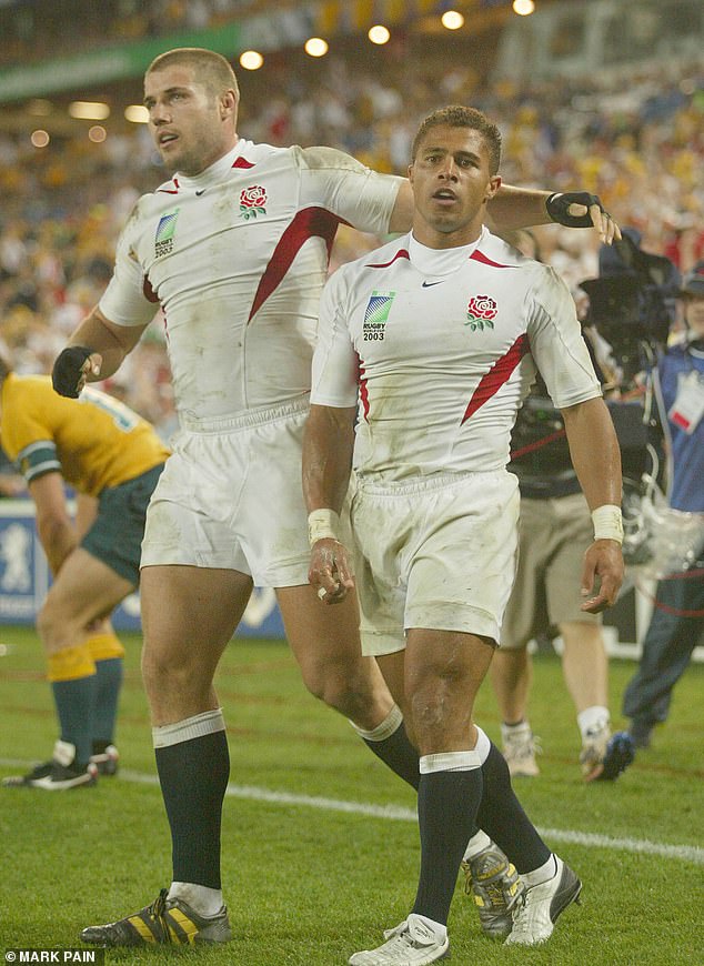 Ben Cohen (left) helps celebrate a try scored by team-mate Jason Robinson (right) during England's victory over hosts Australia in the 2003 World Cup final which his side won 20-17