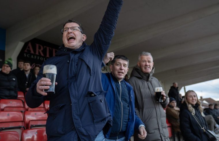 Supporters cheer a Finchley try as Finchley RFC play a Saturday afternoon match against Ealing Trailfinders. A close match in which the hosts Finchley lost 24-26. 14/12/24. Photo Tom Pilston