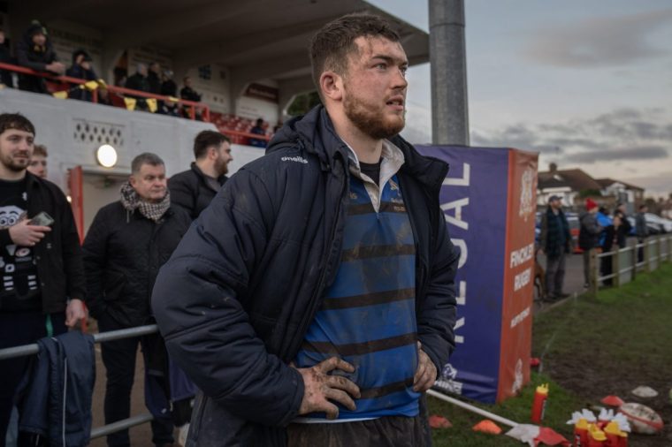 Rested or injured players watch the dying moments as the home side desperately try to save the game as Finchley RFC play a Saturday afternoon match against Ealing Trailfinders. A close match in which the hosts Finchley lost 24-26. 14/12/24. Photo Tom Pilston