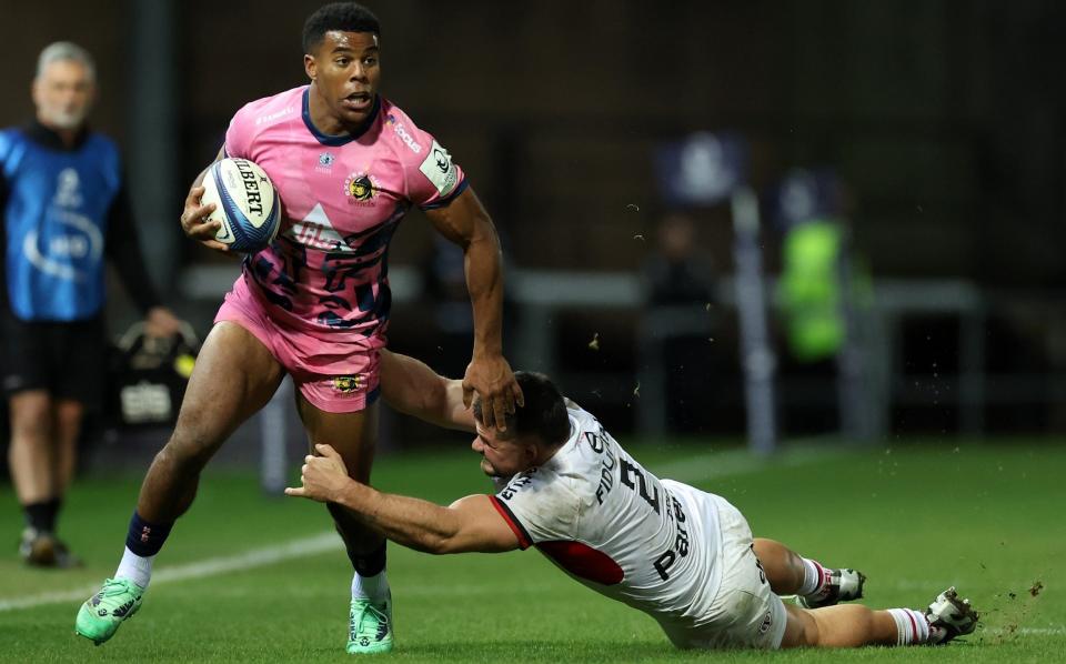 Exeter Chiefs' Immanuel Feyi-Waboso is tackled by Toulouse's Julien Marchand on December 15