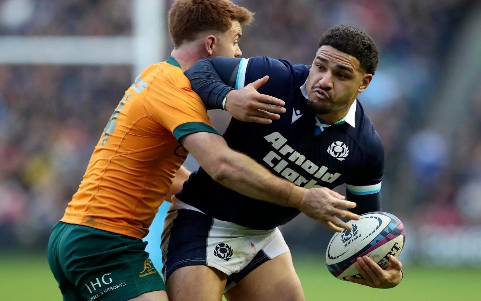 Scotland's Sione Tuipulotu is tackled by Australia's Andrew Kellaway on November 24