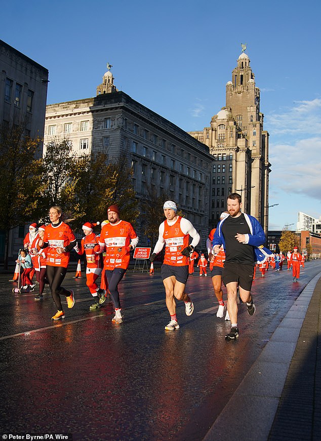 Pictured: Kevin starts his latest fundraising challenge, Running Home For Christmas, at the annual charity fundraising Liverpool Santa Dash event on December 1