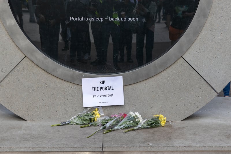 A view of flowers left at the Dublin/New York Portal on North Earl Street after is was shut down. Photograph: Tom Honan