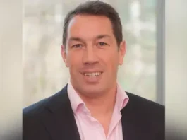 Family handout A head and shoulders shot of Tom Voyce. He is wearing a dark suit jacket and a pink shirt. He's clean shaven, in his forties, with dark hair and is smiling 