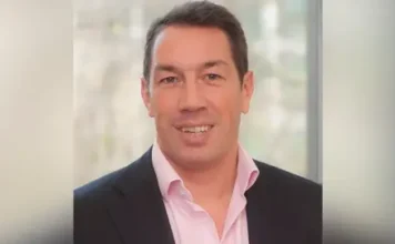 Family handout A head and shoulders shot of Tom Voyce. He is wearing a dark suit jacket and a pink shirt. He's clean shaven, in his forties, with dark hair and is smiling 