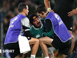 Tom O'Toole is treated by medical staff 