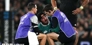 Tom O'Toole is treated by medical staff 