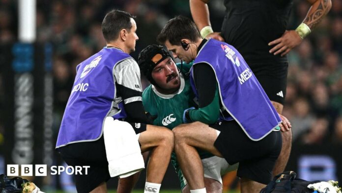 Tom O'Toole is treated by medical staff 