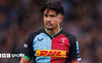 Marcus Smith dives over the line for a try for Harlequins