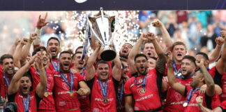 Antoine Dupont lifts the 2024 European Rugby Champions Cup at the Tottenham Hotspur Stadium.