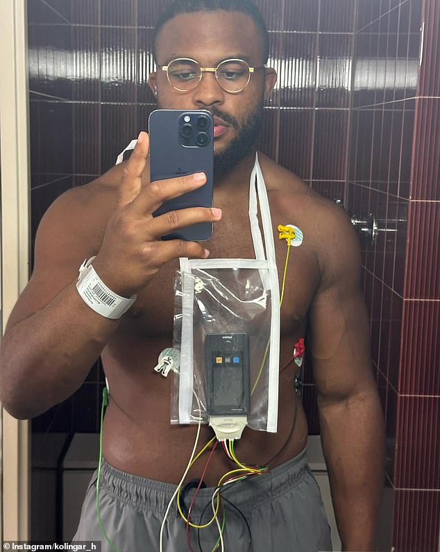 The footy star (pictured wearing a heart monitor) said he 'felt like someone was sticking needles in my head' during the terrifying ordeal