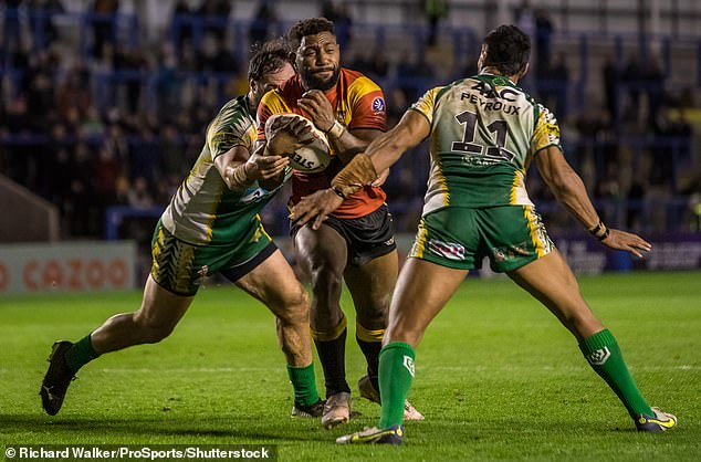 Keven Appo (centre) in action for Papua New Guinea during the 2022 Rugby League World Cup