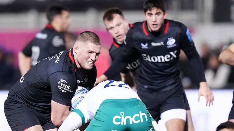 Saracens' Tom Willis (left) is tackled by Fraser Dingwall