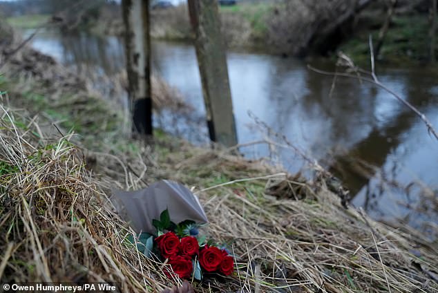 A floral tribute placed at the scene of the River Aln, where Mr Voyce was swept away