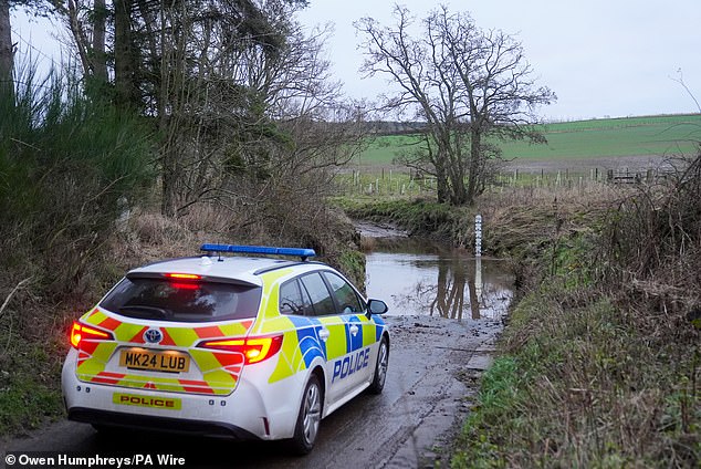 Police at the scene of the River Aln, during the search to find former rugby player Mr Voyce