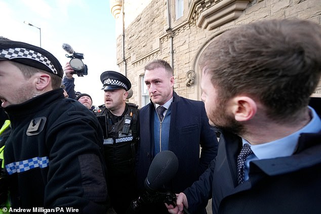 Former Scotland rugby captain Stuart Hogg (centre) leaves Selkirk Sheriff Court, where he was sentenced to a community payback order on January 9