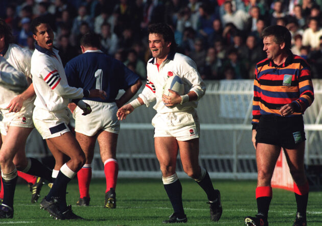 Jeremy Guscott celebrates a try by England captain Will Carling against France at the 1991 Rugby World Cup.