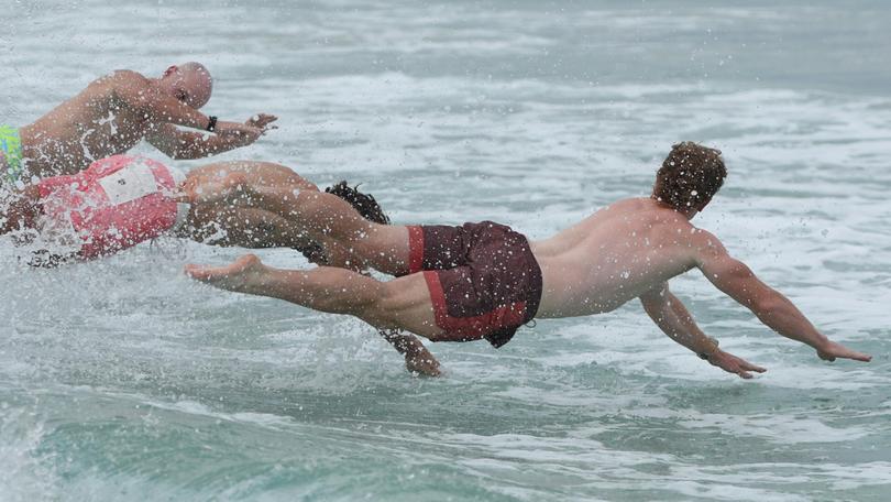 Australia's Henry Hutchison dives in to the water. 