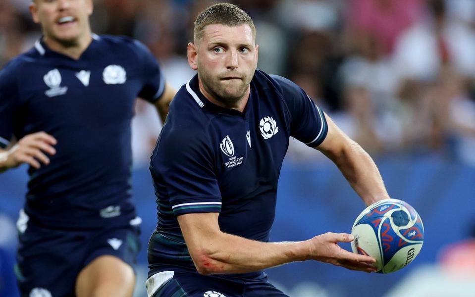 Finn Russell looks to pass against Tonga at the 2023 World Cup