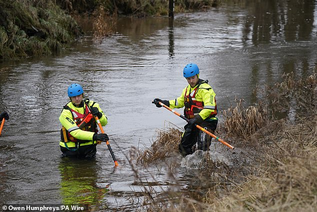 Two members of a search and rescue team during a search operation at Abberwick Ford