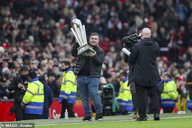 The Manchester United fan paraded the Sid Waddell trophy at Old Trafford when the Red Devils hosted Brighton last month