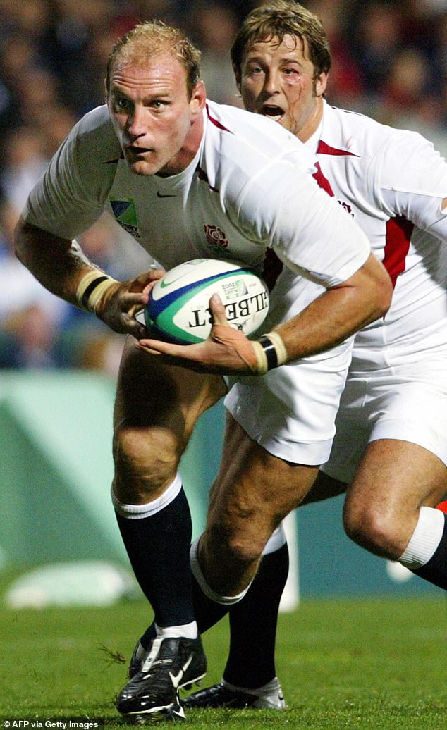 Lawrence Dallaglio moves forward with teammate scrumhalf Andy Gomarsall during their pool match with Georgia in the 2003 Rugby World Cup