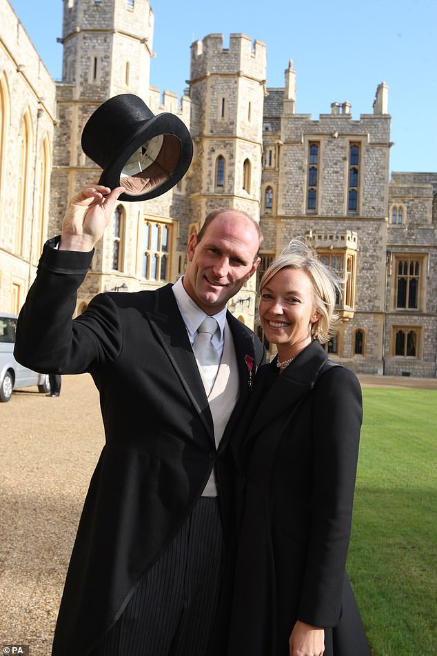 Lawrence Dallaglio with his wife Alice receives as he receives his OBE at Windsor Castle