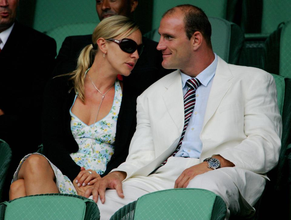 Lawrence Dallaglio and Alice Corbett watching a tennis match.