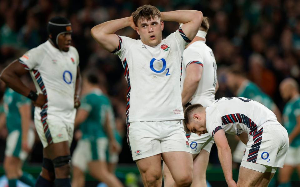 Theo Dan looks dejected after Ireland's Dan Sheehan scores their fourth try