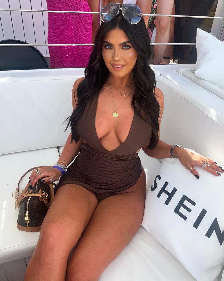 Woman in brown swimsuit at a party.