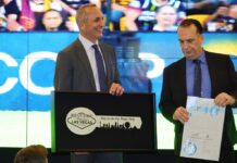 Left to right: National Rugby League CEO Andrew Abdo and Chairman of the Australian Rugby League Commission Peter V'landys are presented with a ceremonial key to the Las Vegas Strip.