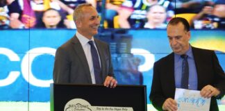 Left to right: National Rugby League CEO Andrew Abdo and Chairman of the Australian Rugby League Commission Peter V'landys are presented with a ceremonial key to the Las Vegas Strip.