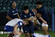 Kepu Tuipulotu runs into a tackle during an England U20 match