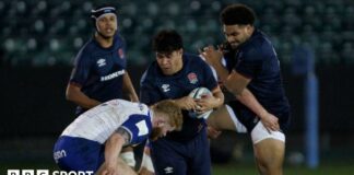 Kepu Tuipulotu runs into a tackle during an England U20 match