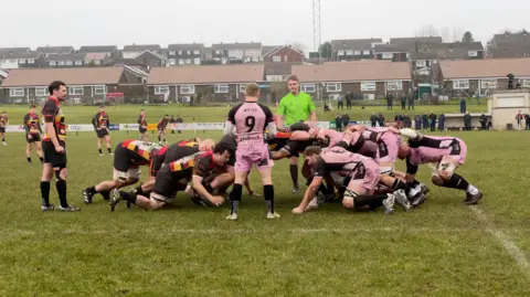 BBC Clifton RFC and Cinderford RFC teams locked in a scrum during a game