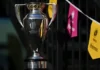 Getty Images A photo of a shiny silver trophy. In the background there are pink and yellow bunting to represent the women's rugby world cup