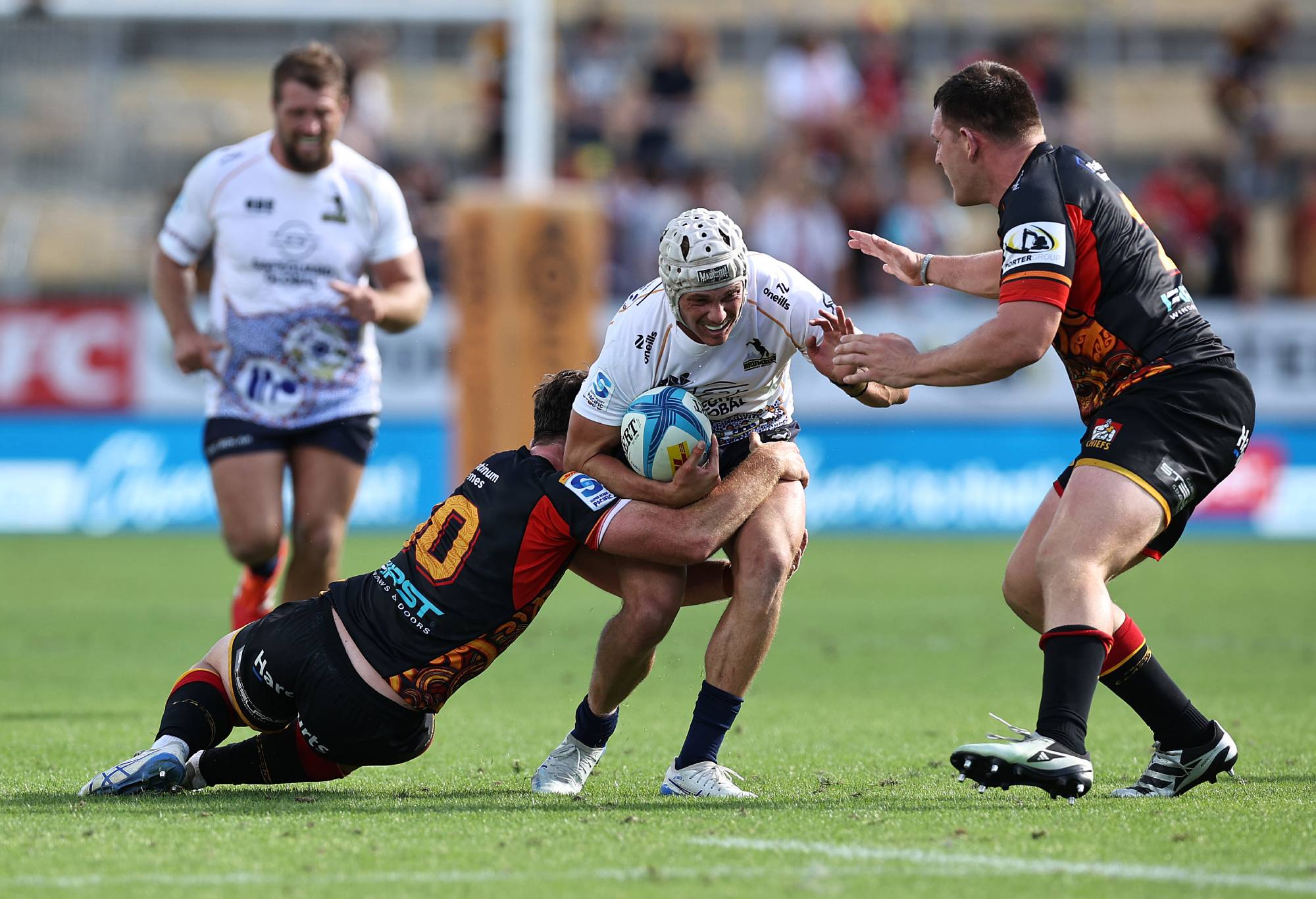 HAMILTON, NEW ZEALAND - MARCH 01: Declan Meredith of the Brumbies is tackled by Josh Jacomb of the Chiefs during the round three Super Rugby Pacific match between Chiefs and ACT Brumbies at FMG Stadium, on March 01, 2025, in Hamilton, New Zealand. (Photo by Dave Rowland/Getty Images)